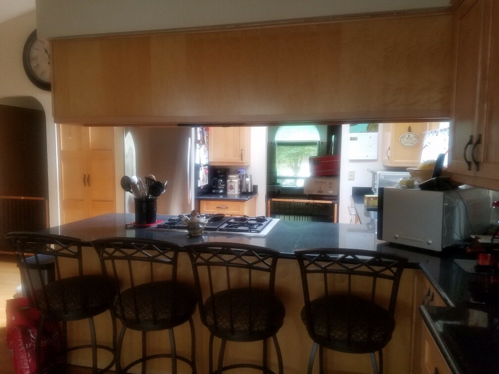 Original kitchen viewed over the breakfast bar before remodel