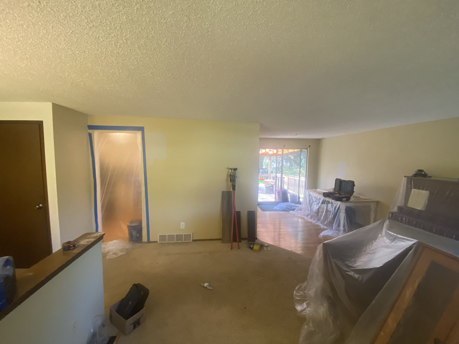 Living area stripped down mid-renovation before remodel