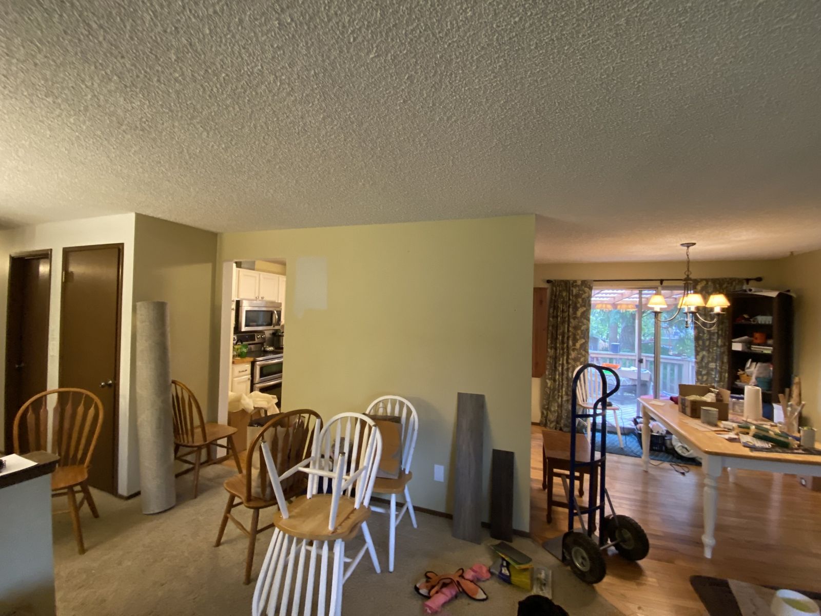 Dining area stripped down mid-renovation before remodel