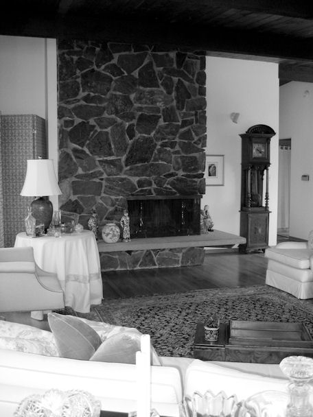 Original stacked stone fireplace before remodel