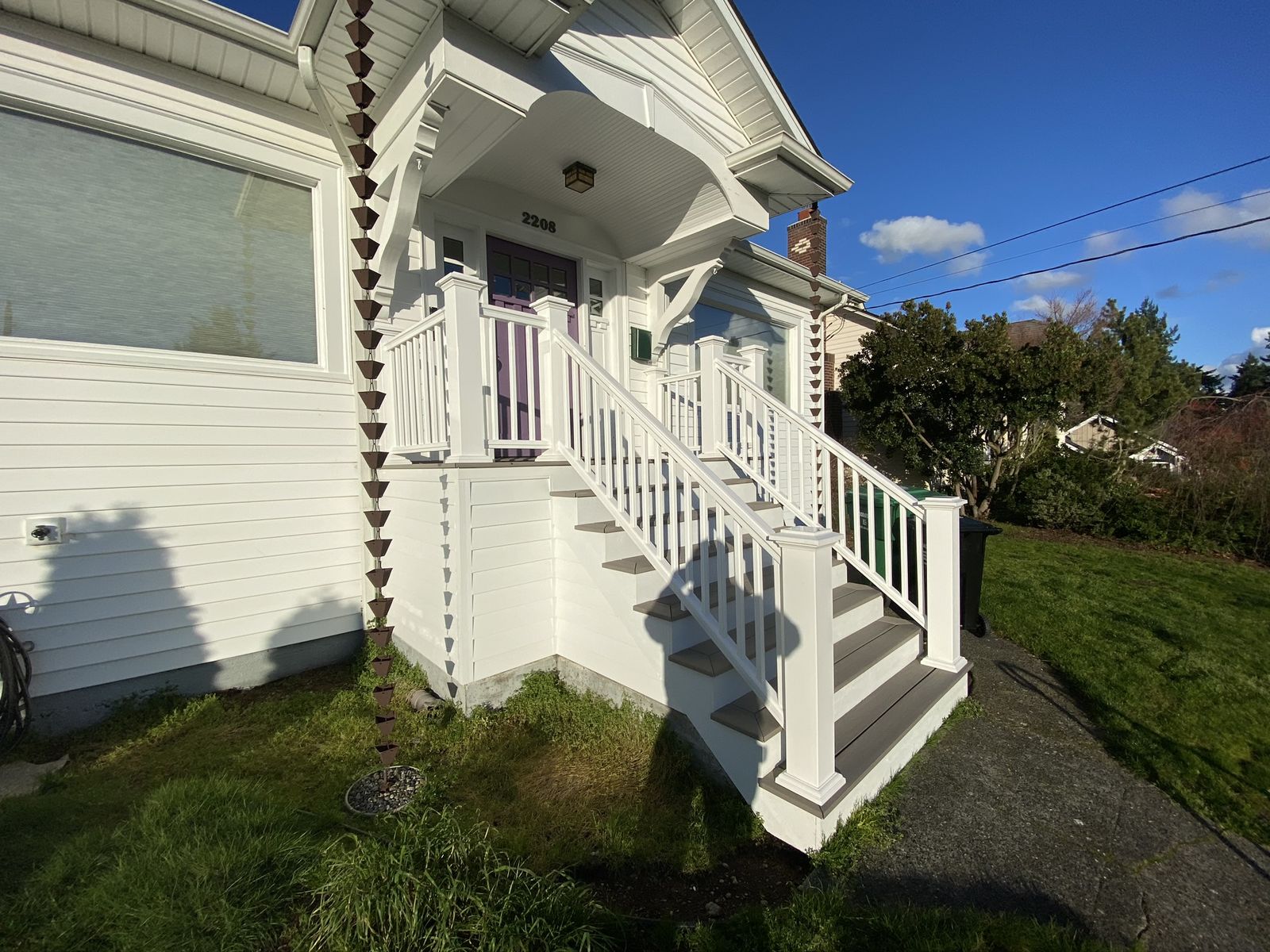 Front porch and stairs viewed from the yard