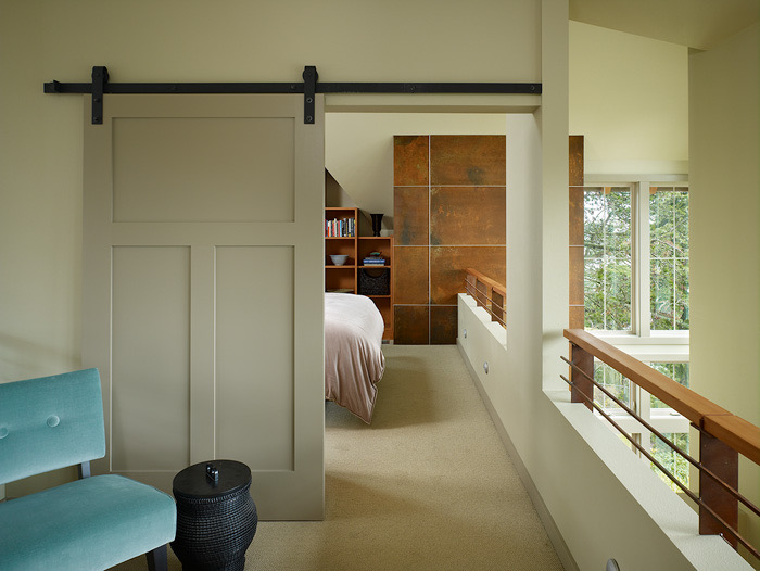 Upstairs landing with sliding barn door leading to the master bedroom